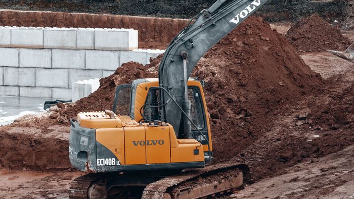 Excavator carrying out earthworks on site