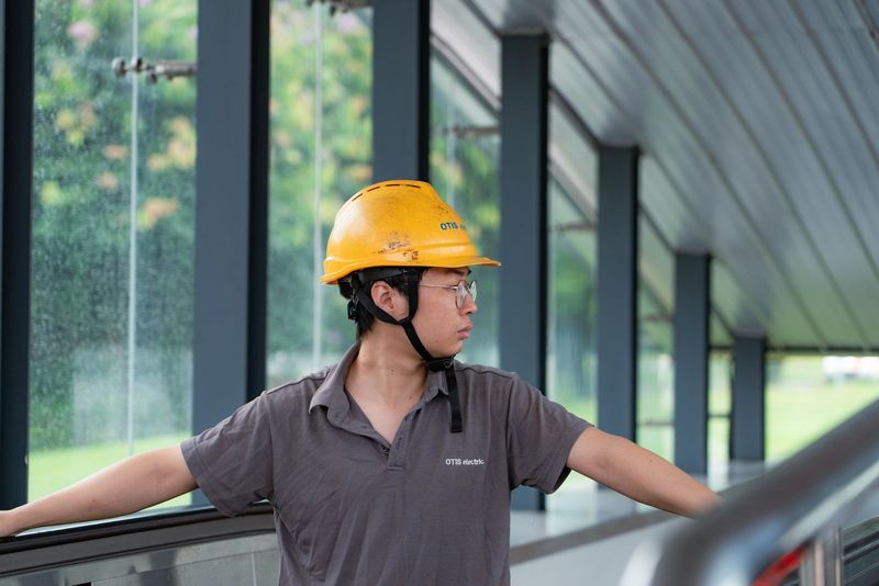 Site worker wearing a safety helmet